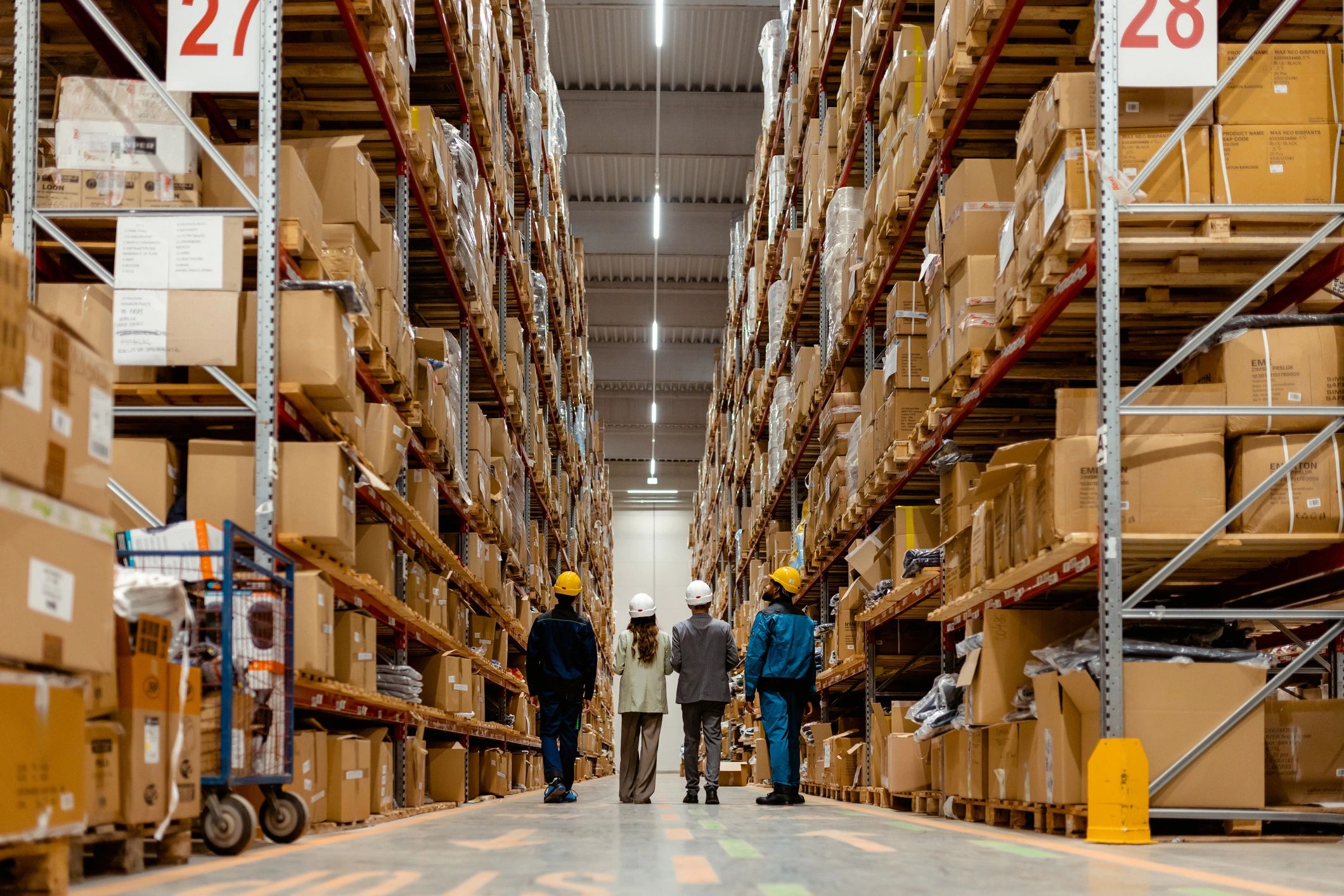 Warehouse team walking through inventory representing secure handling and fulfillment