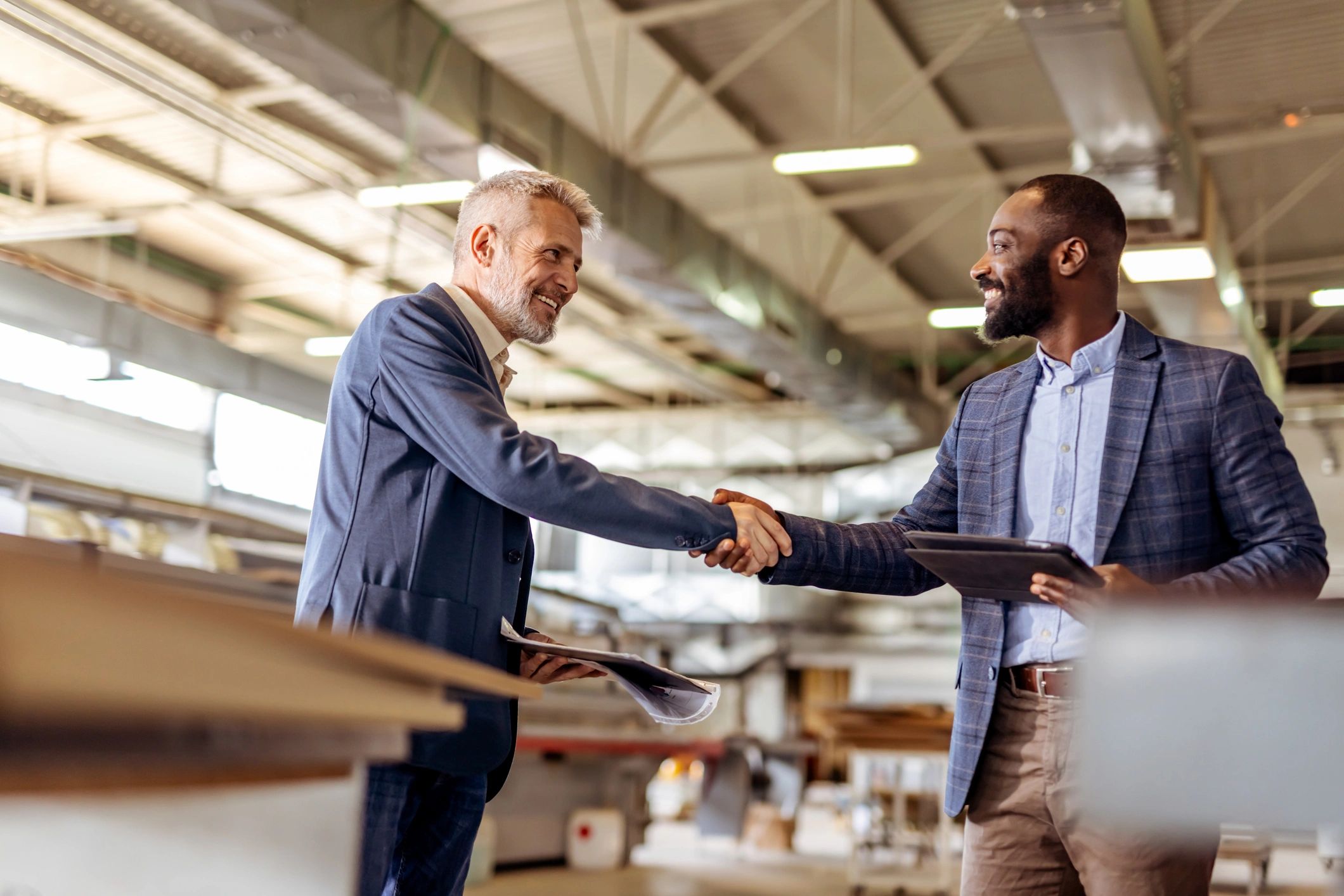 Business handshake representing Technest client support and partnerships